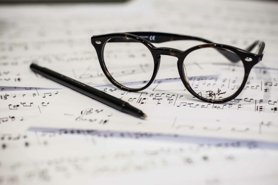 Free Image of Eyeglasses on a musical score sheet 