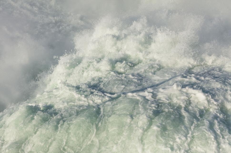 Free Image of Crashing frothy ocean waves captured in motion 