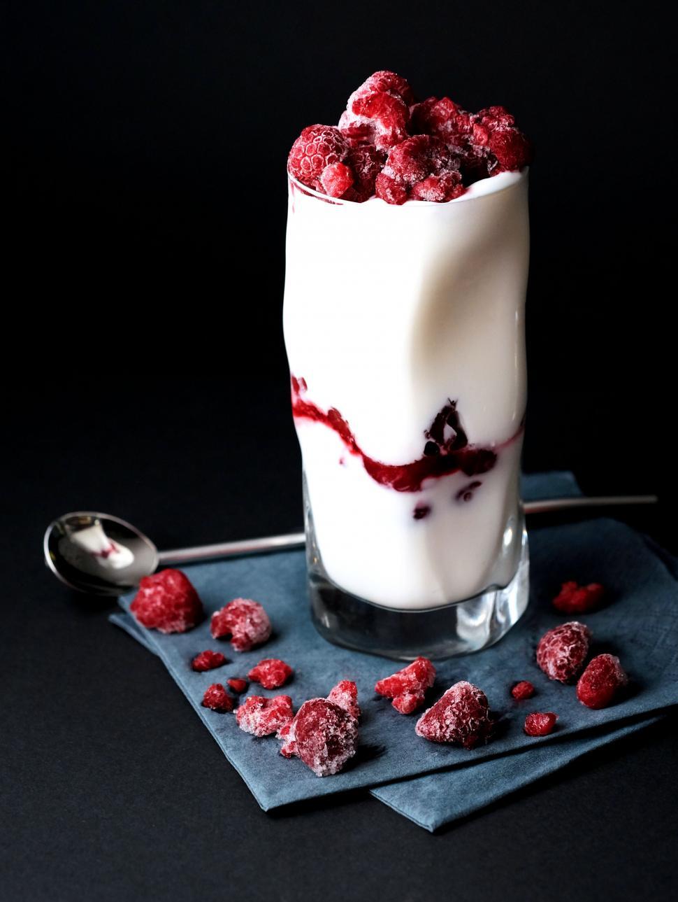 Free Image of Raspberry dessert in glass on a dark background 
