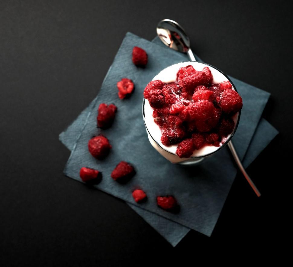 Free Image of Overhead shot of raspberry dessert on slate 
