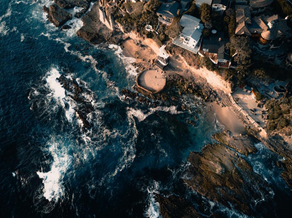 Free Image of Aerial view of rocky coastline and beach 
