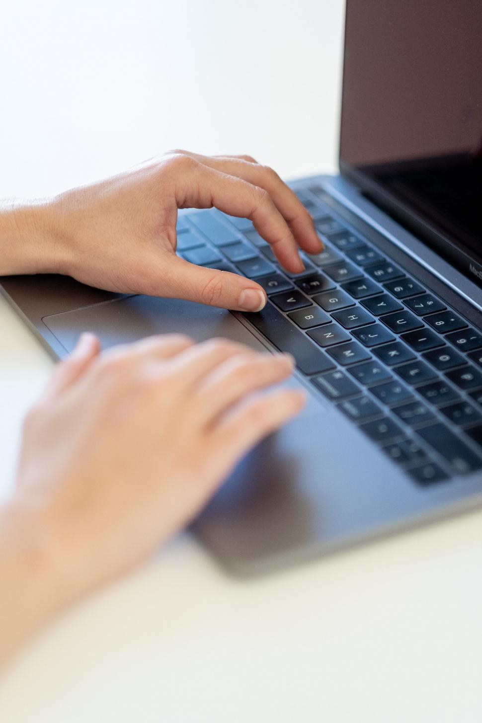 Free Image of Person typing on a laptop keyboard 