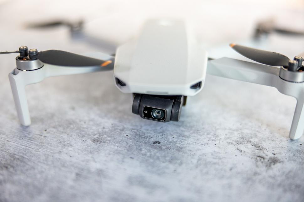Free Image of Drone with camera on concrete surface 