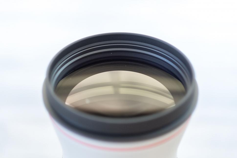 Free Image of Close-up shot of a camera lens on white 