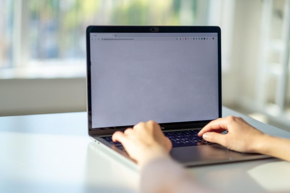 Free Image of Person typing on a laptop computer 