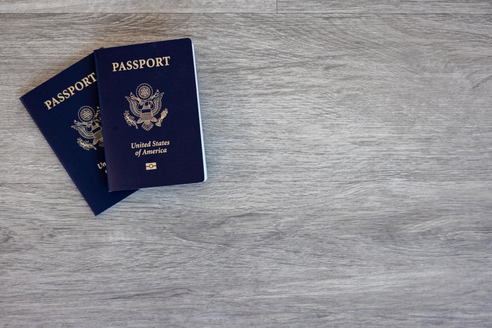 Free Image of Two US passports on a wooden table 