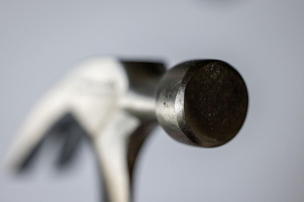 Free Image of Close-up of a hammer head on grey background 