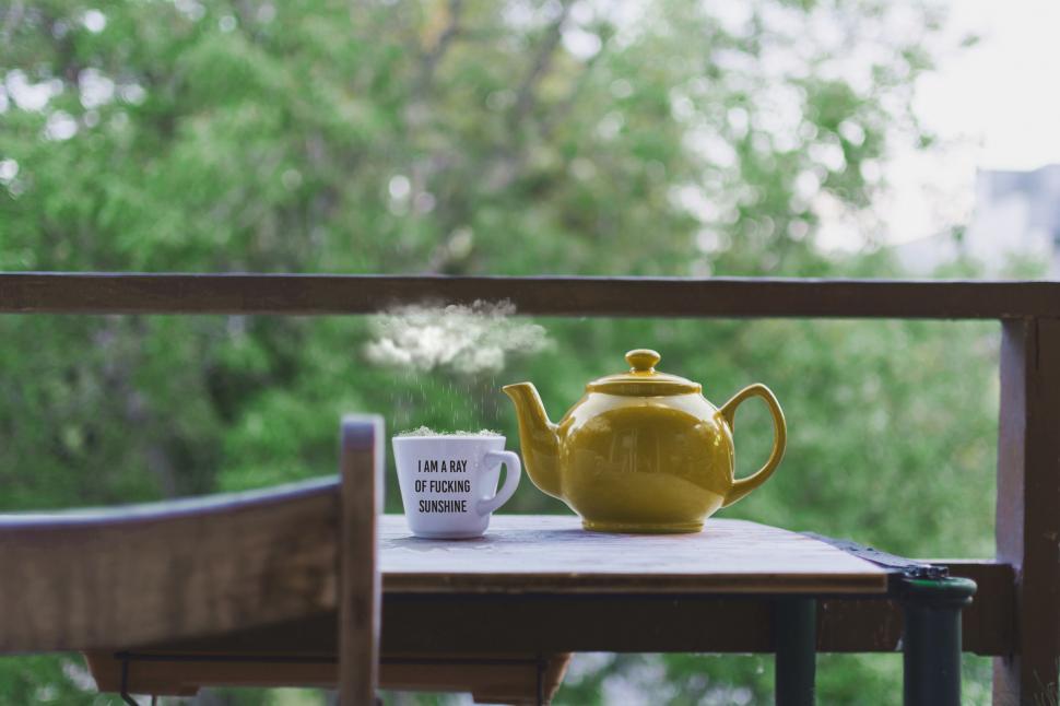 Free Image of Morning tea time on a rustic balcony 