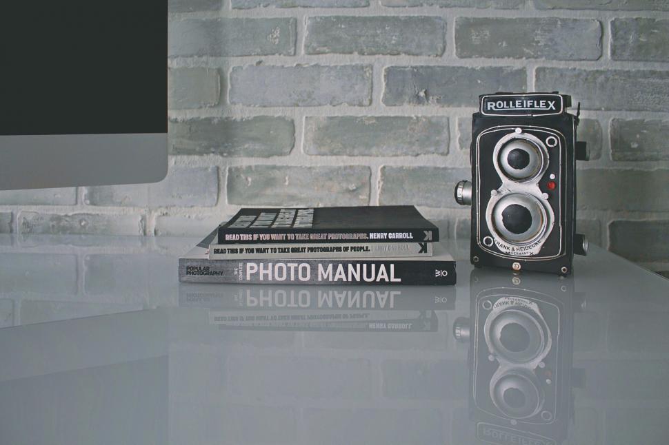 Free Image of Vintage camera and photography books 