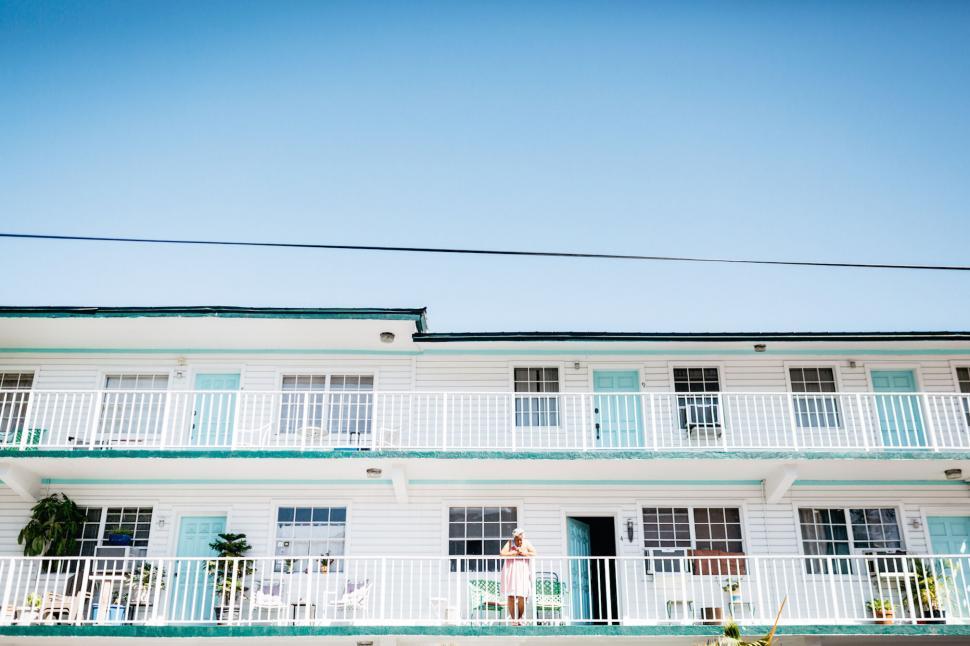Free Image of Bright motel facade under blue sky 