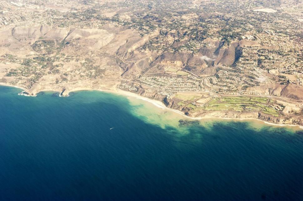 Free Image of Aerial view of coastline with contrasting tones 