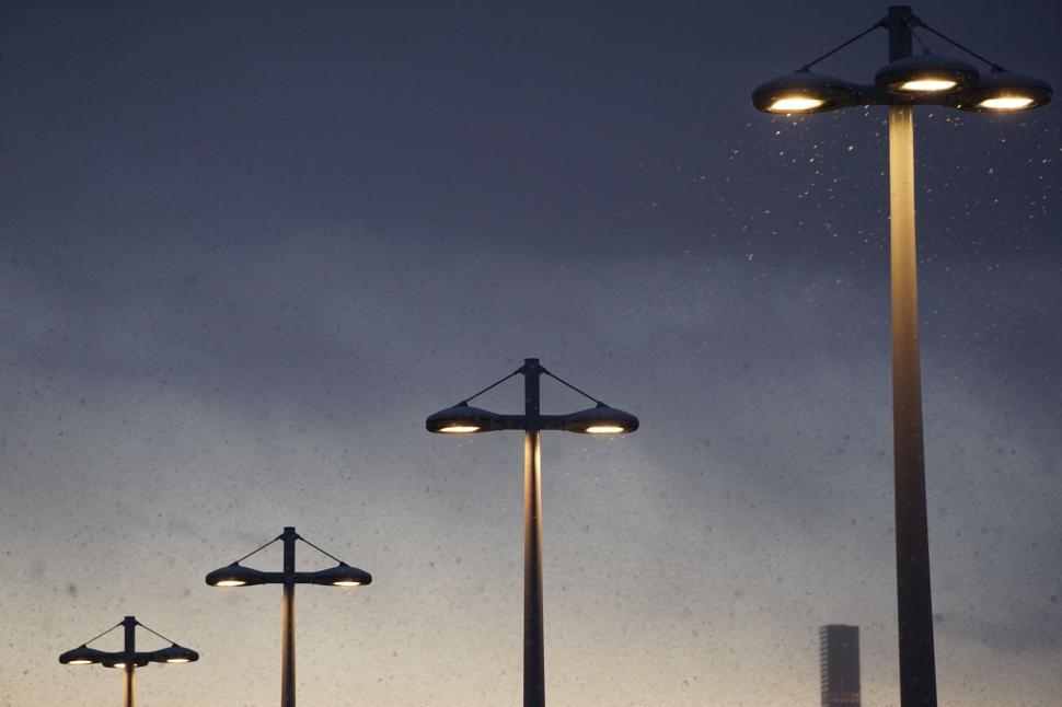 Free Image of Street lamps lighting up at dusk 
