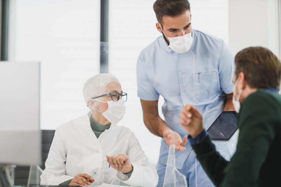 Free Image of Doctor discussing with a patient in clinic 