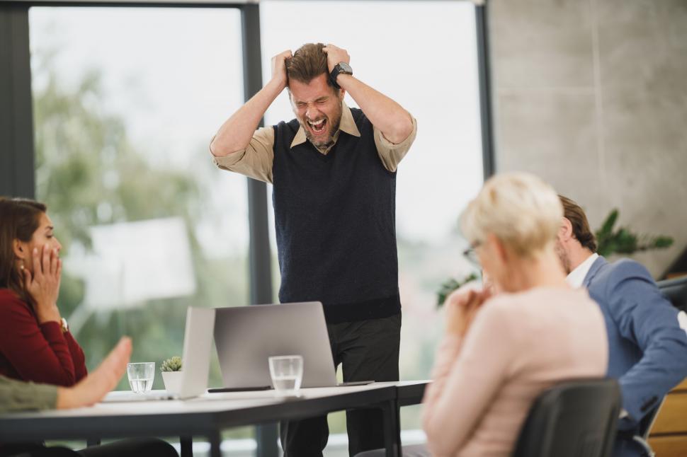 Free Image of Frustrated businessman in a meeting 