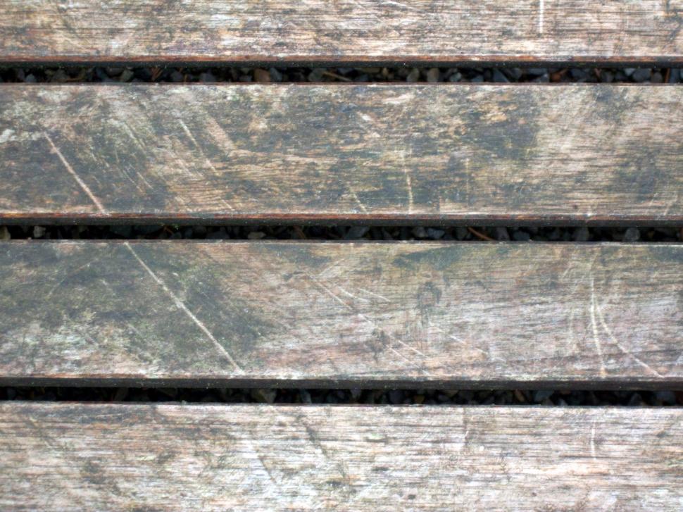 Free Image of Close Up of a Wooden Bench With Peeling Paint 