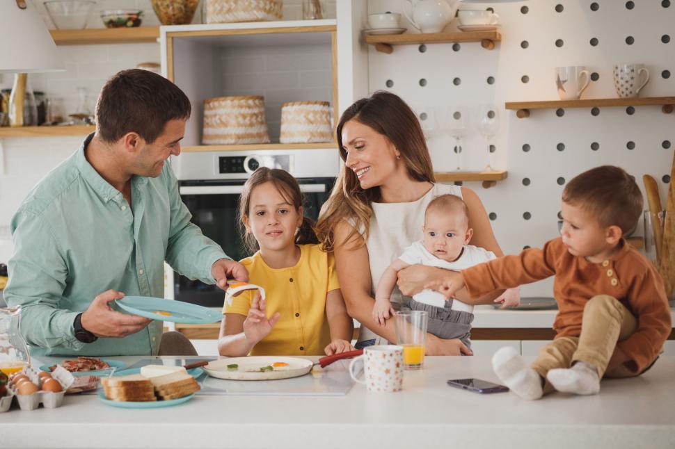 Free Image of Enjoyable family breakfast at kitchen home 