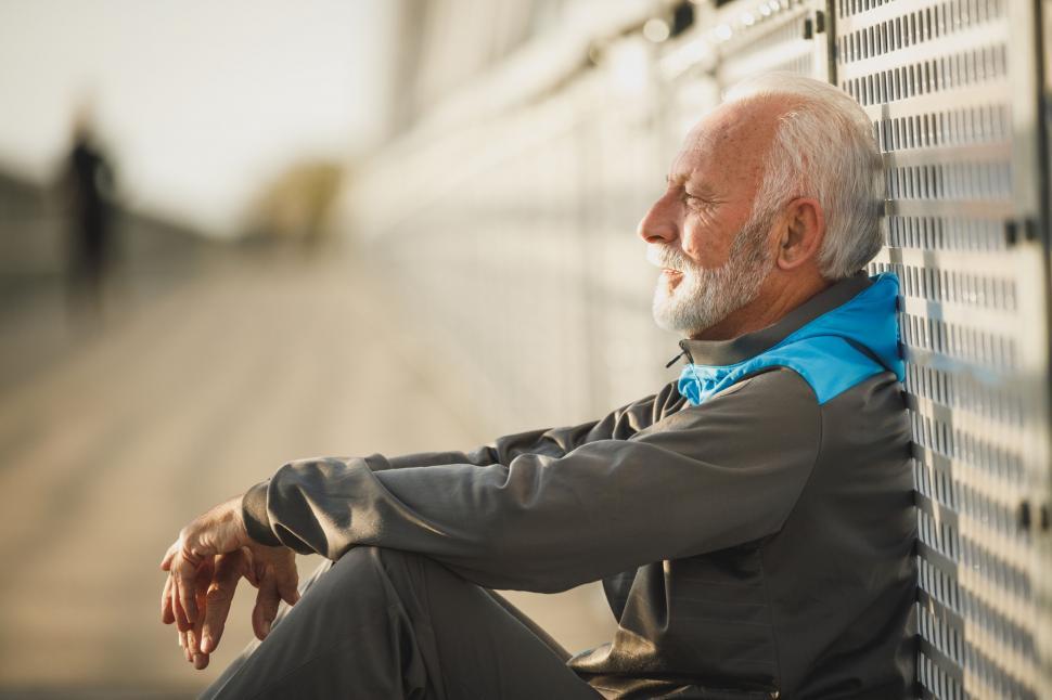 Free Image of Elderly man resting after outdoor activity 