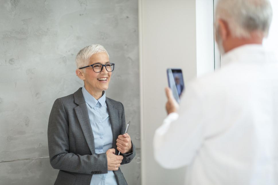 Free Image of Smiling woman being photographed 