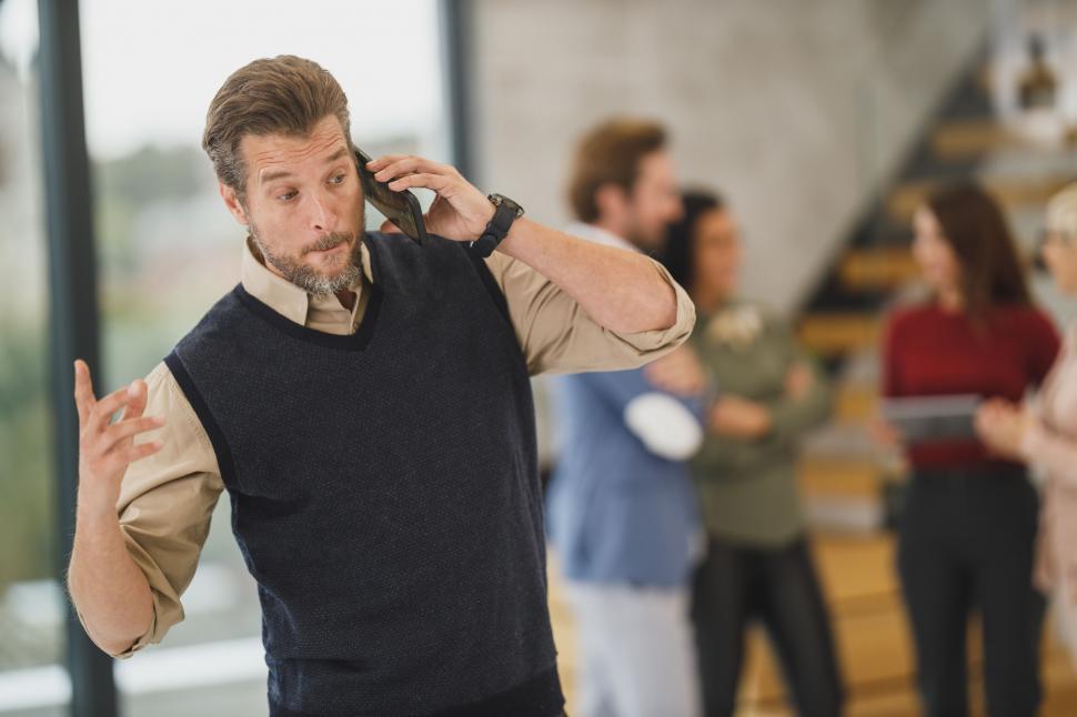 Free Image of Confident man talking on the phone 