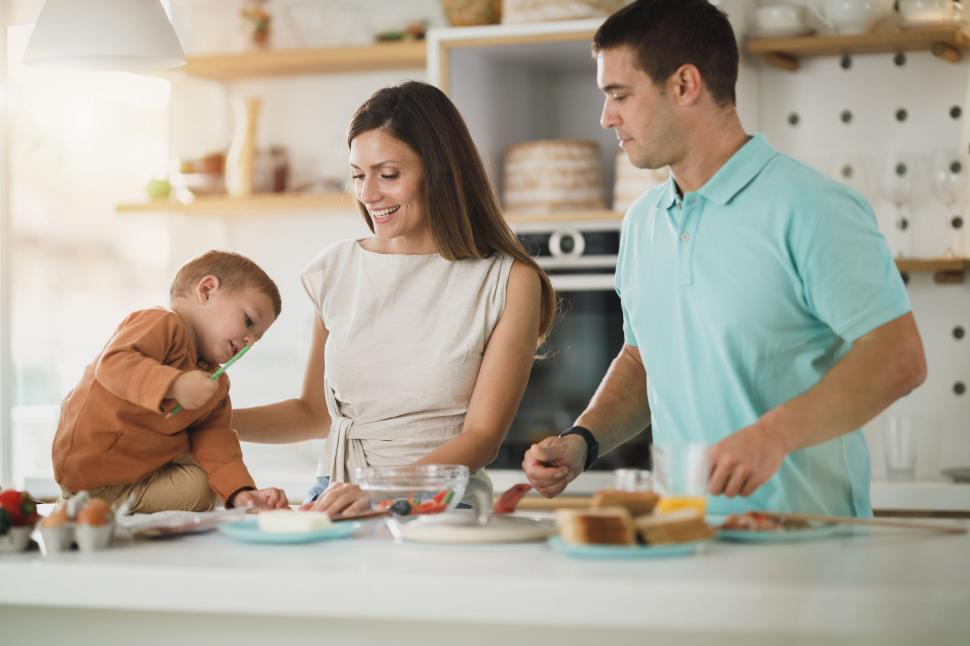Free Image of Family cooking together in the kitchen 