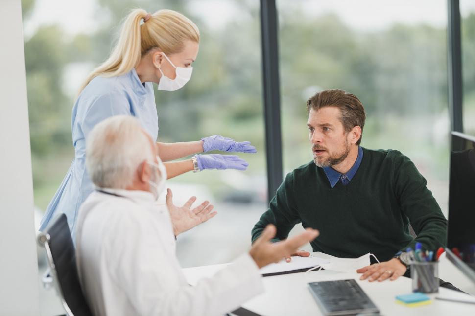 Free Image of Healthcare professional consulting with a patient 