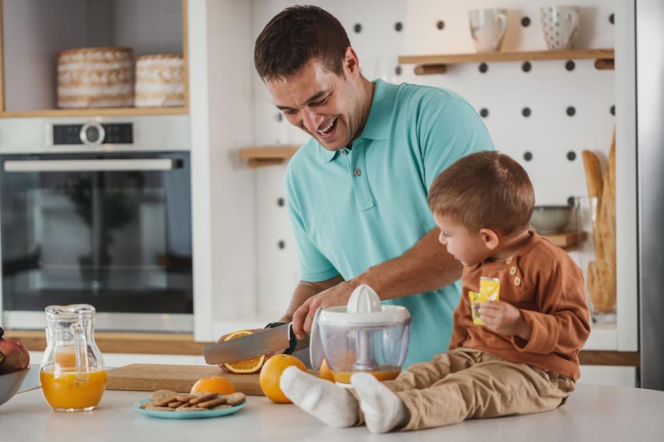 Free Image of Father and child making breakfast together 