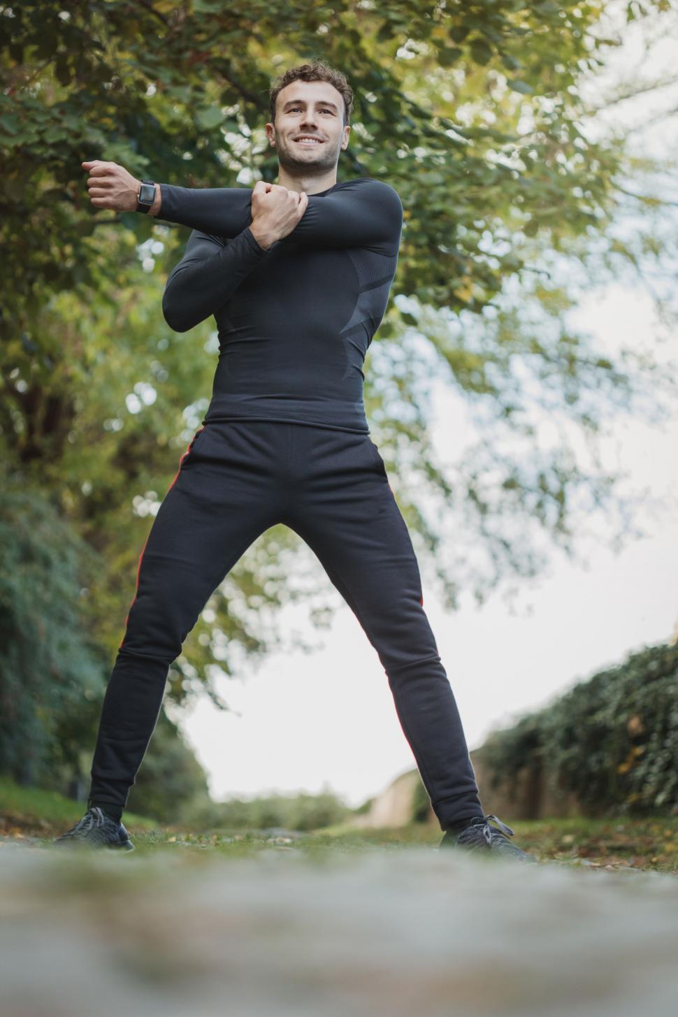 Free Image of Man stretching during outdoor exercise 