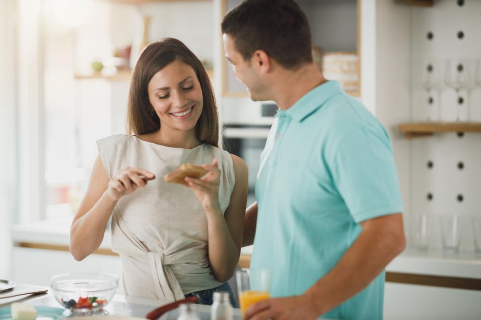 Free Image of Couple having a fun cooking moment 