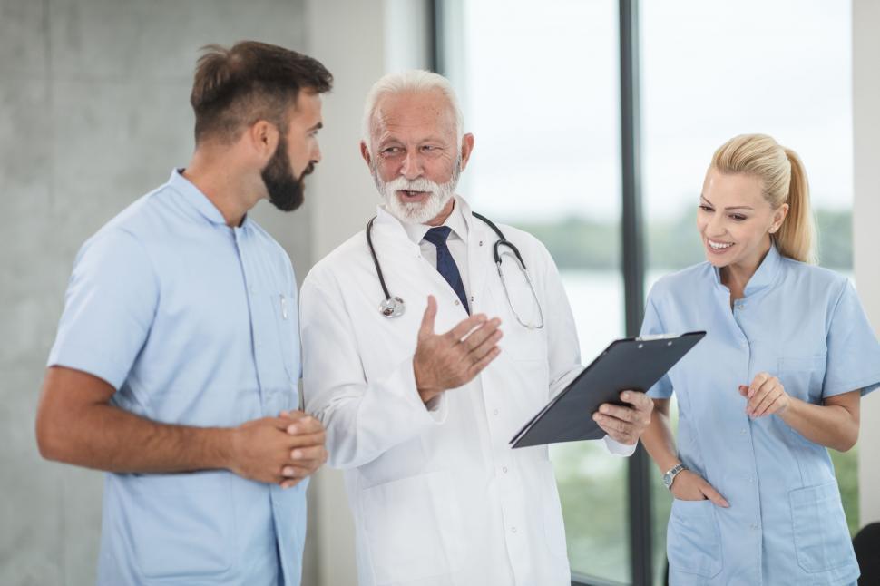 Free Image of Medical team discussing with senior doctor 