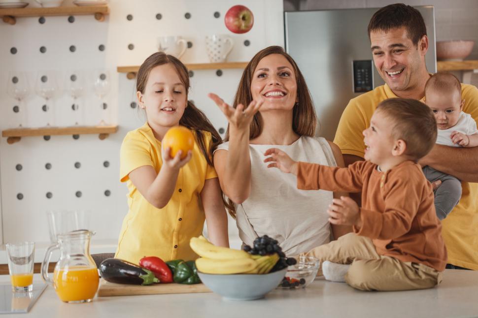 Free Image of Family enjoying time together in the kitchen 