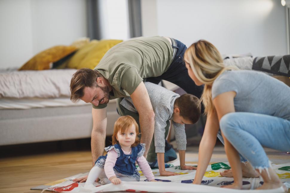 Free Image of Family playing Twister at home 