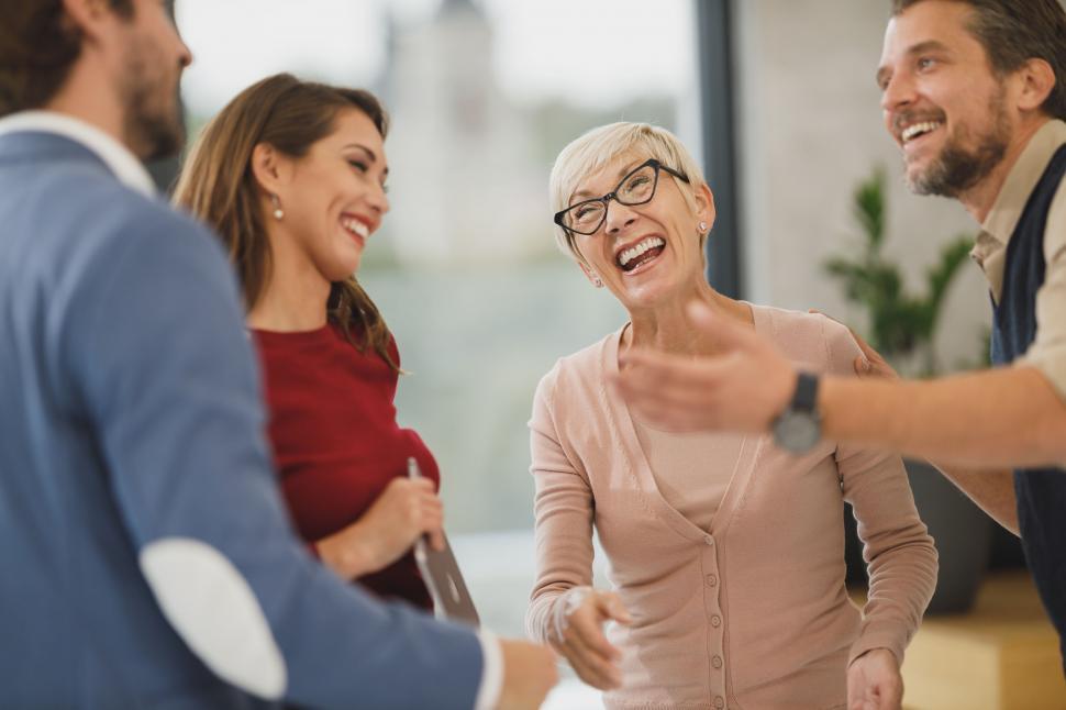 Free Image of Business people sharing a laugh in office 