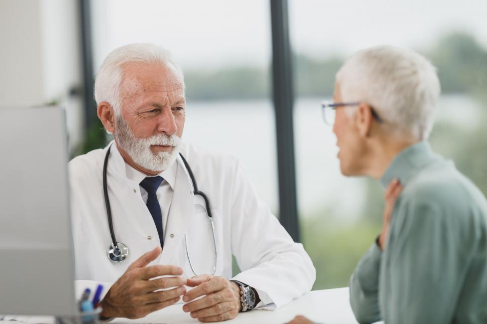 Free Image of Doctor consulting with a patient in hospital 