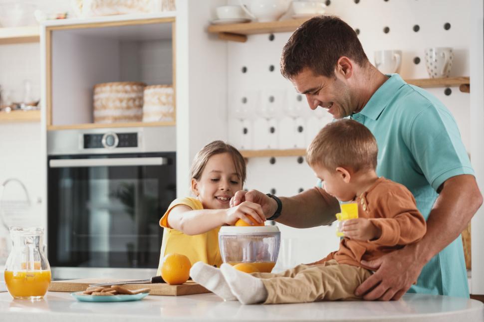Free Image of Family bonding during cooking activity 