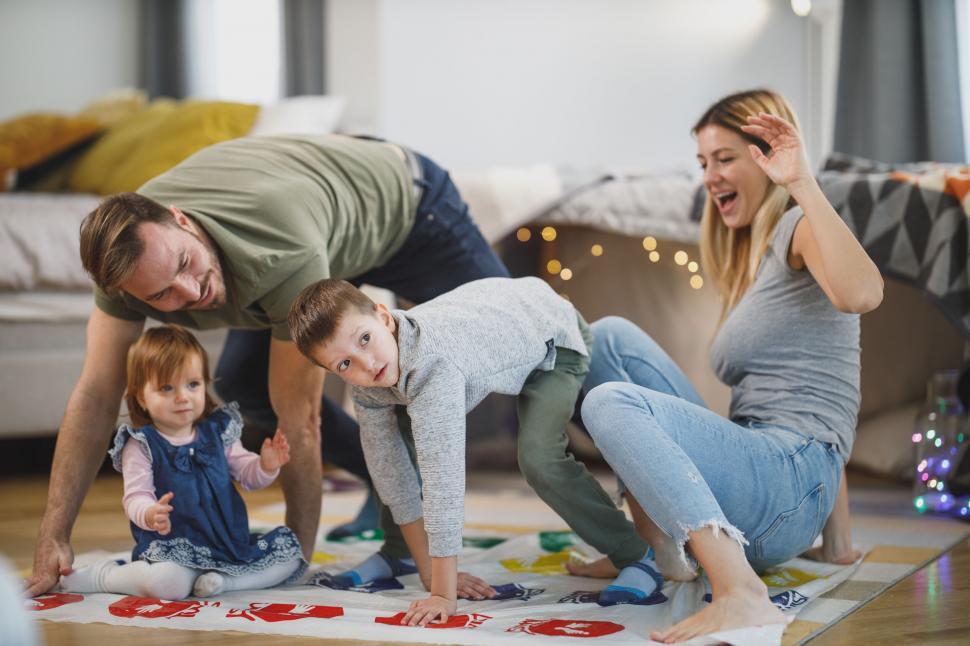 Free Image of Family playing Twister game at home 