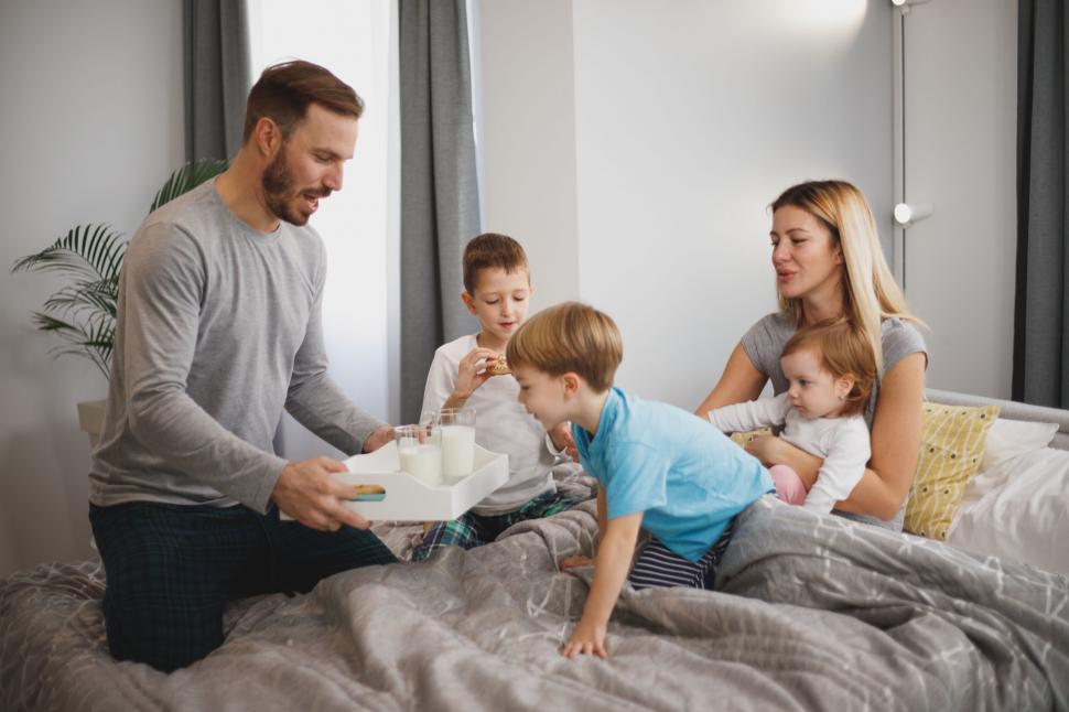 Free Image of Family enjoying breakfast in bed together 