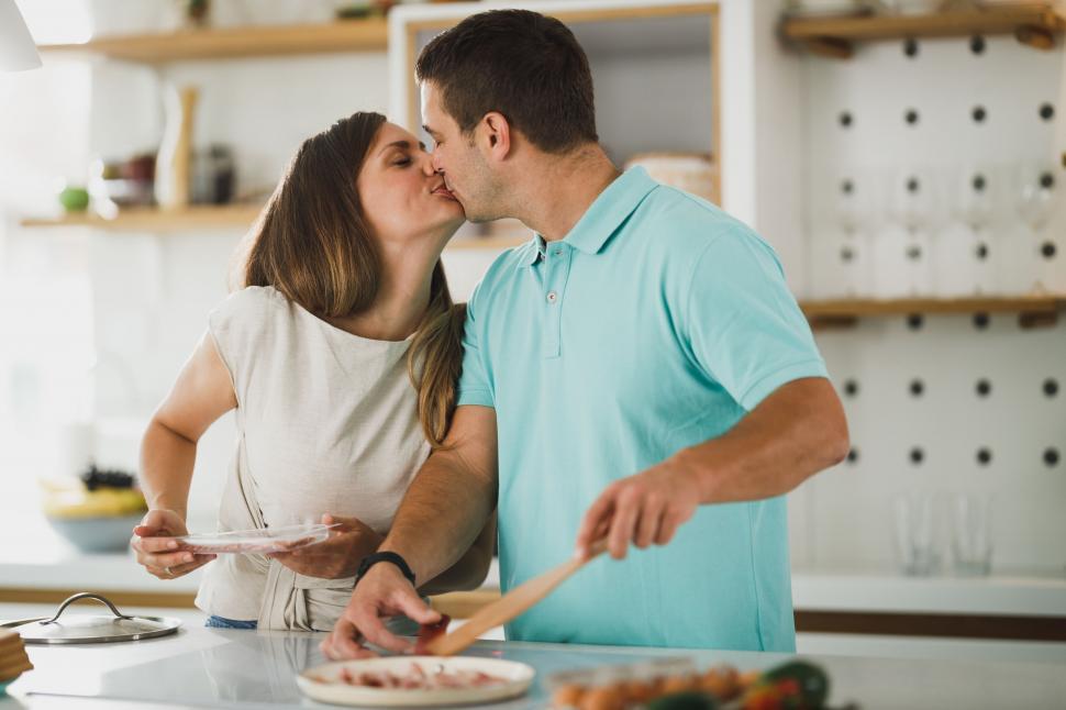 Free Image of Couple cooking together in modern kitchen 