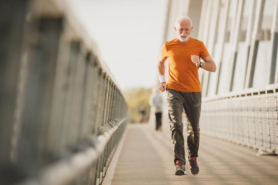 Free Image of Senior man energetically running in urban area 