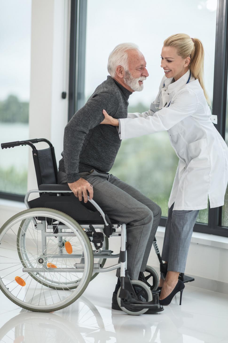Free Image of Senior man with doctor in wheelchair 