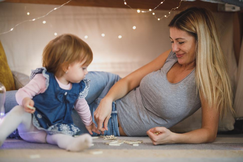 Free Image of Mother playing with toddler at home 