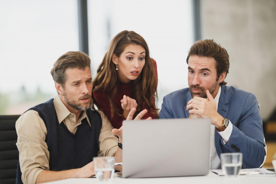 Free Image of Business team engaged in intense discussion 