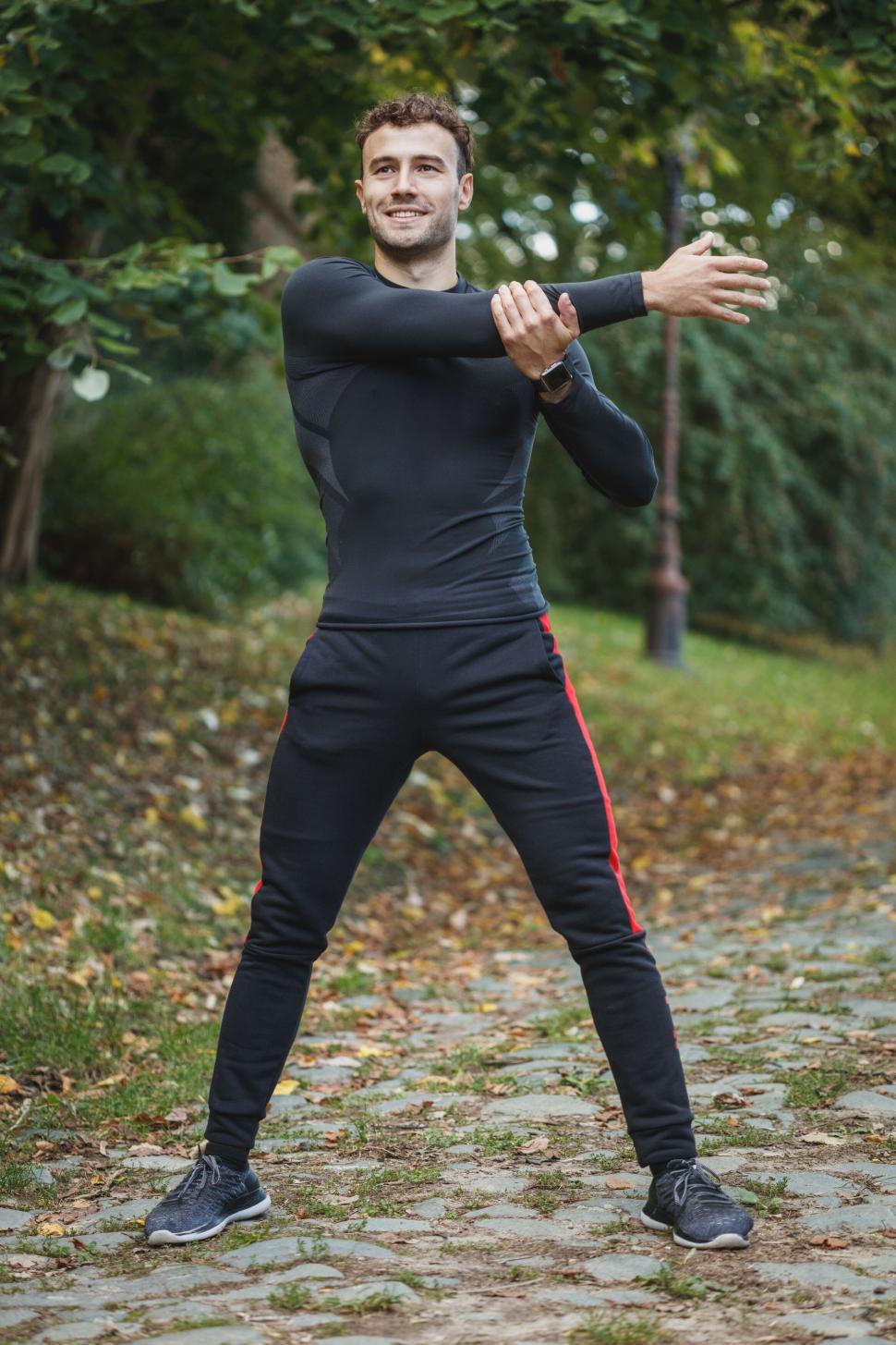 Free Image of Man stretching during outdoor workout 