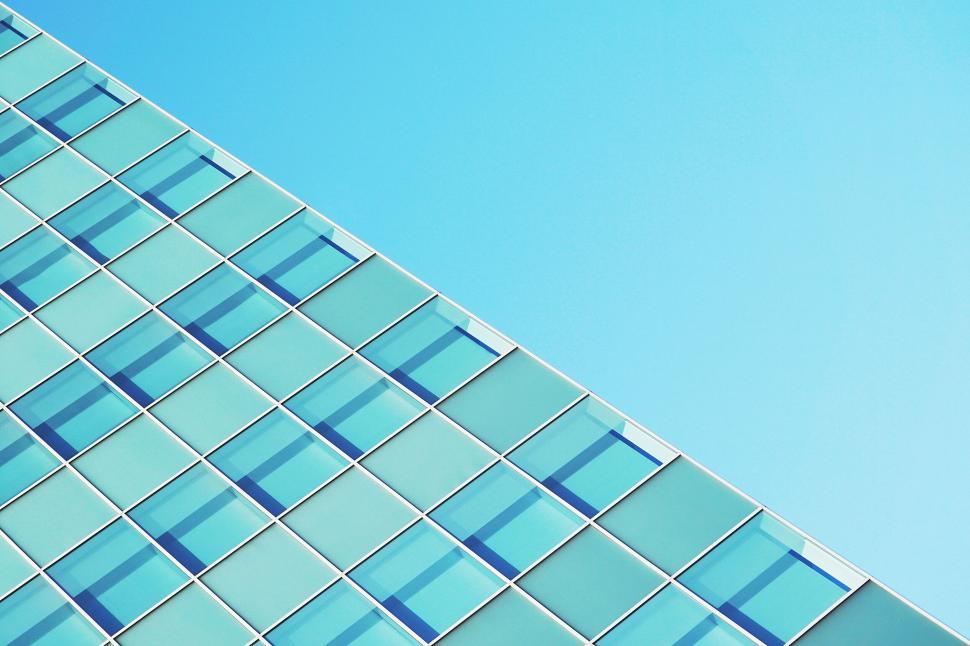 Free Image of Diagonal blue glass building facade clear sky 