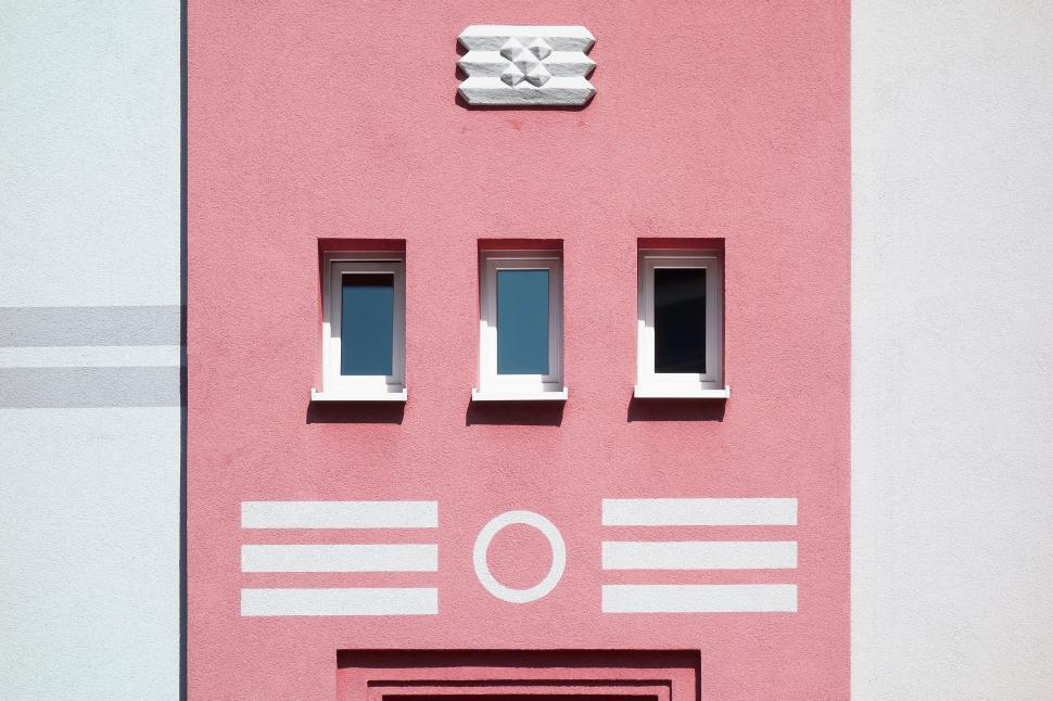 Free Image of Pink building facade with unique pattern 