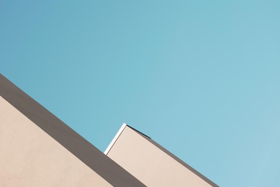 Free Image of Minimalist roofline against clear blue sky 