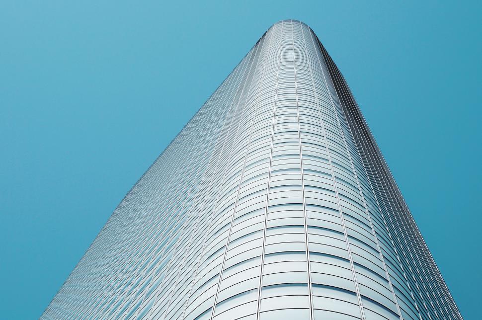 Free Image of Modern skyscraper towering into blue sky 