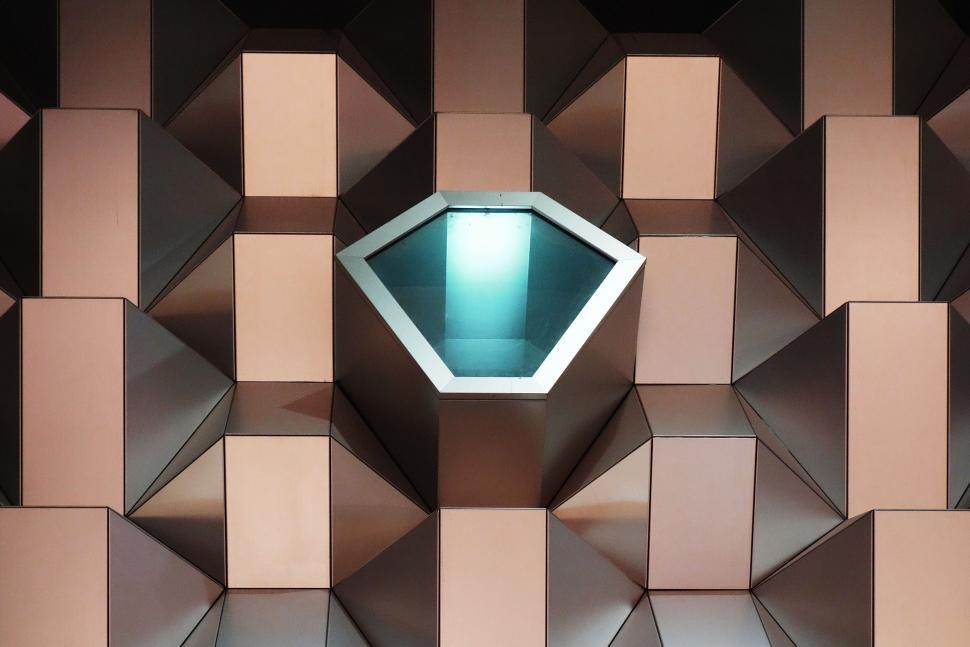Free Image of Geometric light fixture on copper wall 
