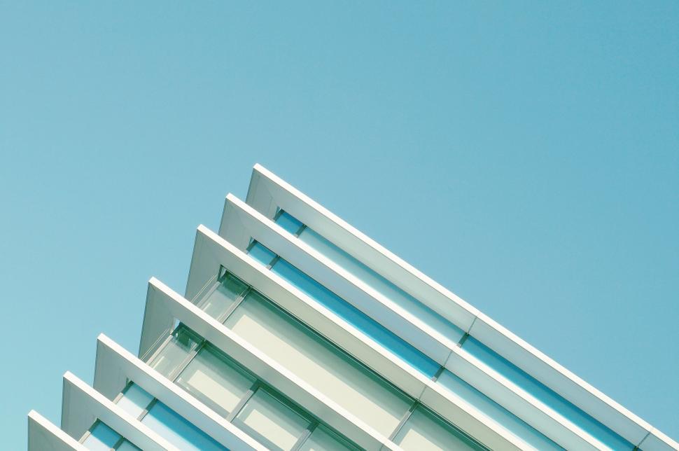 Free Image of Modern building with blue sky and white louvers 