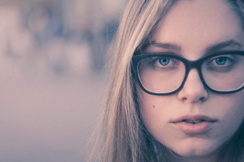 Free Image of Young woman with glasses in close-up 