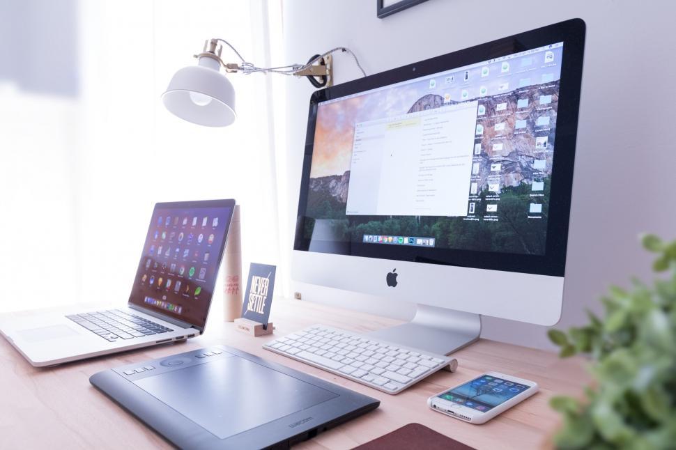 Free Image of Modern home office setup with Apple devices 